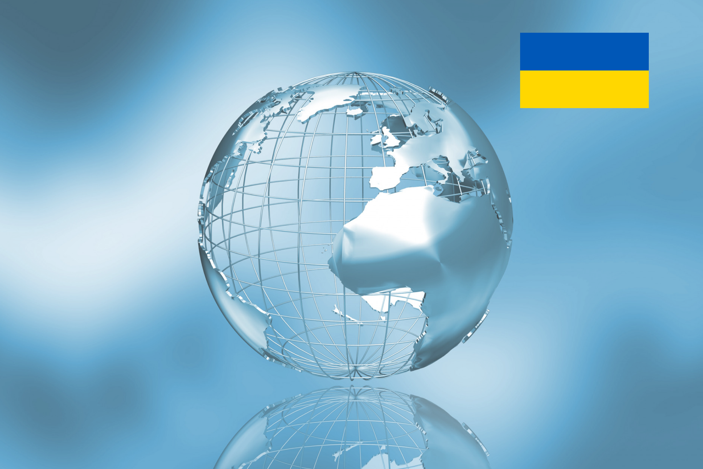 Metalinio korpuso žemės modelis, šalia Ukrainos vėliava
